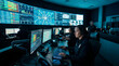 © Valfiyy - Cyber Security Operations Center with Analysts Monitoring Data on Large Screens