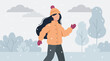 © siddiqa - Woman in winter clothes walking in snowy park, flat vector illustration