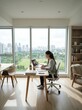 © Feri - Young Asian Student Studying Online with Laptop at Home