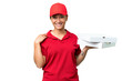 © luismolinero - pizza delivery woman with work uniform picking up pizza boxes over isolated chroma key background laughing