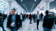 © Curioso.Photography - Crowd of business professionals walking through a busy convention center during a trade show, conference or corporate event.