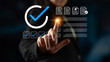 © InfiniteFlow - A business professional interacts with a digital check mark symbol and document graphics, symbolizing success, productivity, and digital transformation in the modern office. Cyphers
