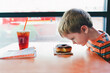 © Natalie Wheeler - boy looking at doughnut