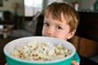 © Natalie Wheeler - Boy holding popcorn bowl