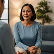 © SYATRI RAWU - Middle-aged woman expressing deep emotion and vulnerability during a professional therapy session in a home office, concept of mental health counseling