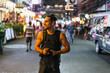 © Nazareno - Male photographer enjoying vibrant urban night street