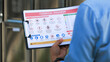 © Piya W. - Focused inspector holding clipboard ensures chemical storage compliance during outdoor industrial safety audit with serious attention
