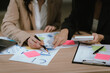 © Kieng - Business professionals collaborate in a modern office, reviewing financial reports, analyzing performance data, discussing strategy, budgeting, and planning projects for business growth and success.