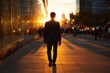 © Vlad - Back view of a young professional in a suit walking away through a sunset cityscape