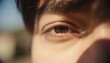 © Future Vision - Showing close-up right eye reflecting warm sunlight outdoors, with brown iris, brow and eyelashes