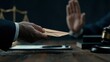 © SSP - A person offers an envelope while another hand gestures to refuse, with a judge's gavel and scales in the background symbolizing legal ethics.