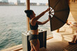 © Jacob Lund - Sauna master performs wellness ritual with heat fan and relaxing guest