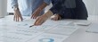 © rogerphoto - Professional team analyzing financial reports, sharing insights and planning strategic decisions in modern workplace setting. Business people concept
