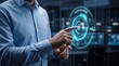 © Nusrat - Man using holographic assessment interface for financial planning and performance monitoring in dark technological workplace with glowing neon blue graphics displaying progress charts data.