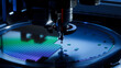 © IM Imagery - Computer Chips are being Extracted by a Pick and Place Machine from a Wafer and Attached to a Substrate. Microchip Manufacturing at a Factory. Close-up of Semiconductor Packaging Process.