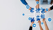© InfiniteFlow - A dynamic scene illustrating teamwork and collaboration in a modern business environment, featuring hands assembling puzzle pieces with digital icons symbolizing innovative solutions. Amity
