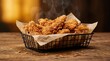 © Gennyson Marinho - Crispy fried chicken pieces served in a rustic basket with steam rising against a warm background