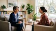 © Pris - Therapist and client in a counseling session discussing mental health and well-being in a comfortable office setting