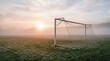 © Biggy - Misty Sunrise Over Empty Soccer Field with Goalposts and Soft Green Grass