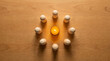 © Suresh - Wooden peg figures arranged in a perfect inward-facing circle representing trust, team unity, cooperative bond, safe community, organizational cohesion and collective strength.