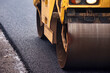 © Aleksandr - Paving Process for Urban Road With Asphalt Concrete During Daytime Work in City