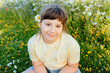 © Cavan Images - Portrait of smiling child girl in wildflower meadow