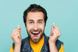 © LIGHTFIELD STUDIOS - Handsome stylish man wearing summer attire with an authentic smile and earphones in bright colors