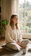© Valistrum - A serene woman meditating at home, bathed in natural light streaming through a window. She sits cross-legged on a cushion, eyes closed, with a gentle smile, embodying peace and mindfulness