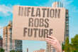 © AndriiKoval - 'Inflation robs future' Rising costs steal from tomorrow. ROB. FUTURE. SAVINGS. HOPE. DEPRIVE.