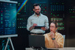 © Zamrznuti tonovi - It team collaborating in a server room, managing network infrastructure, monitoring system performance, and ensuring data security
