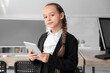 © Pixel-Shot - Little girl studying with tablet at school computer lab