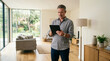 © 123sasha - Man using tablet in modern living room