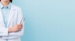 © dmmarychev - female dentist in white lab coat holding dental tools on blue background with copy space