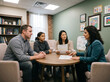 © krismicrostoker - Family gathers around round table during therapy session