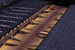 © AmazingAerialAgency - Aerial view of a logistics center at night with illuminated loading docks, warehouse buildings, and a parked truck in Warsaw, Masovian Voivodeship, Poland.