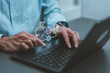 © HappyEva - Human-AI Strategist synergy concept man typing laptop digital hologram artificial intelligence brain robot handshake business partnership future technology transformation machine learning growth