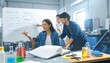 © MuhammadAmin - Diverse engineering team brainstorming technical solutions around a whiteboard