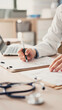 © sebra - Medical doctor completing administrative healthcare records