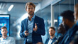 © v.stock - Confident sales agent presenting product advantages during a professional business meeting.