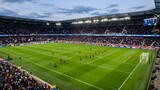 Aerial drone view of a vibrant green professional soccer stadium field