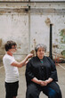 © Luciano Spinelli/Stocksy - Hair Styling Session in an Industrial Space With a Creative Twist