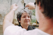 © Luciano Spinelli/Stocksy - Pov portrait haircut With Scissors