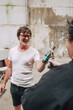 © Luciano Spinelli/Stocksy - Friends Toasting Beer Bottles