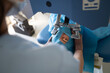 © Hernandez & Sorokina/Stocksy - Surgeon Performs a Procedure on a Patient in a Eye Clinic