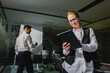 © muse studio - Team members engaged in a creative brainstorming session in a modern office space during evening hours