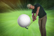 © New Africa - Man playing golf on course. Ball flying into camera, motion blur effect