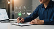 ©  Arise Leo - Procurement process management, Digital and paper document approval, contract verification, supplier negotiation, and business purchasing operations using laptop and paper in office environment