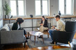 © Miljan Živković - Diverse people networking and collaborating in modern co working space