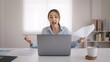 © ChayTee - Bad Gen Z boss video call work argue point face stress yelling anger hate speech. Asia people woman fight on laptop videocall upset mad bossy. Online job issue mental health illness burnout at office.
