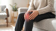 © Mike Stock - Home healthcare image of painful knee symbolizing joint inflammation, chronic pain, and orthopedic wellness.